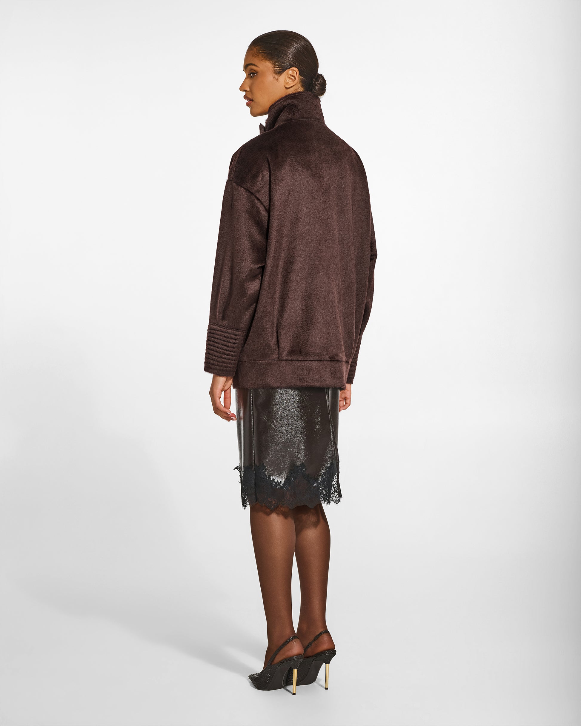 SENTALER Stand Collar Aviator Jacket in Chocolate Brown, Suri Alpaca. Worn by a female model, back view, buttoned.
