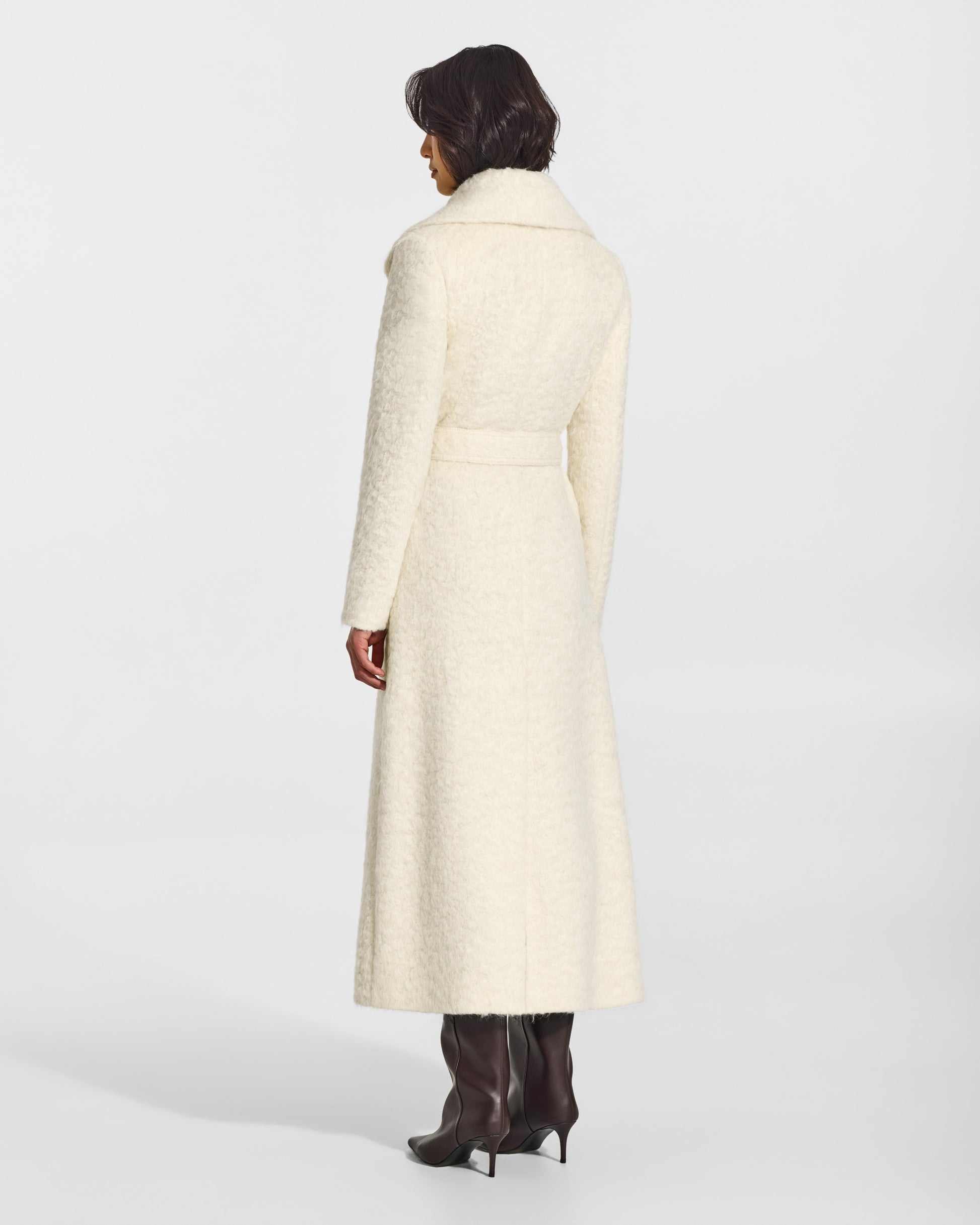 SENTALER Maxi Shawl Collar Wrap Coat in Cloud White, Textured Suri Alpaca. Worn by a female model, back view, belted.