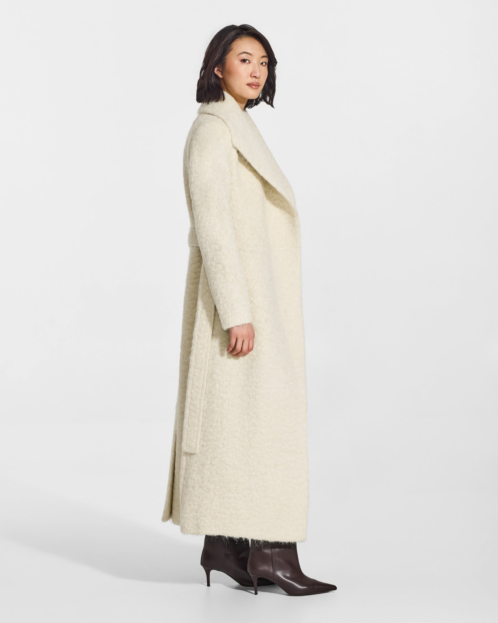 SENTALER Maxi Shawl Collar Wrap Coat in Cloud White, Textured Suri Alpaca. Worn by a female model, side view, open.