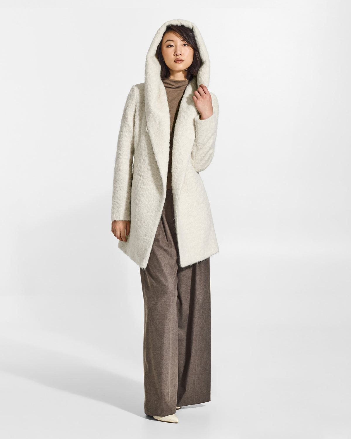 SENTALER Short Hooded Wrap Coat in Cloud White, Textured Suri Alpaca. Worn by a female model, front view, open.