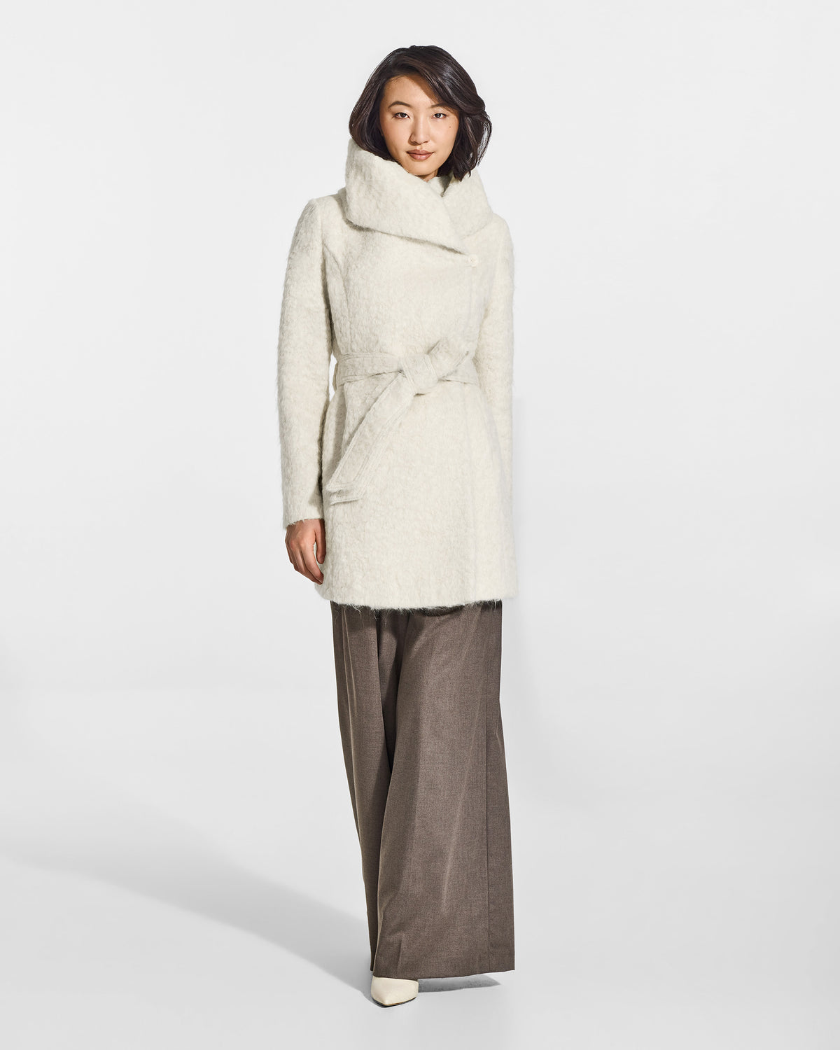 SENTALER Short Hooded Wrap Coat in Cloud White, Textured Suri Alpaca. Worn by a female model, front view, belted.