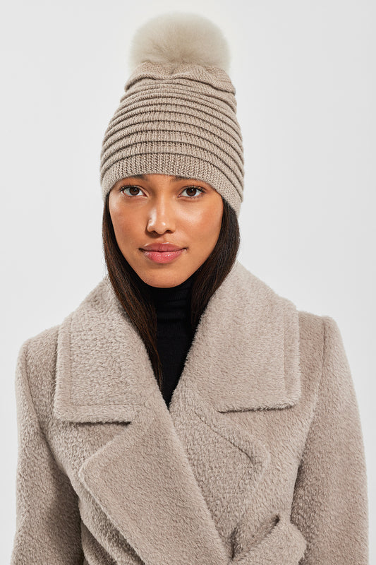 Sentaler Adult Ribbed Hat With Oversized Fur Pompon featured in Baby Alpaca and available in Light Taupe. Seen from front.