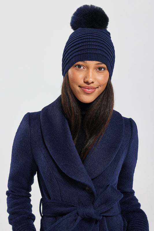 Sentaler Adult Ribbed Hat With Oversized Fur Pompon featured in Baby Alpaca and available in Navy. Seen from front.