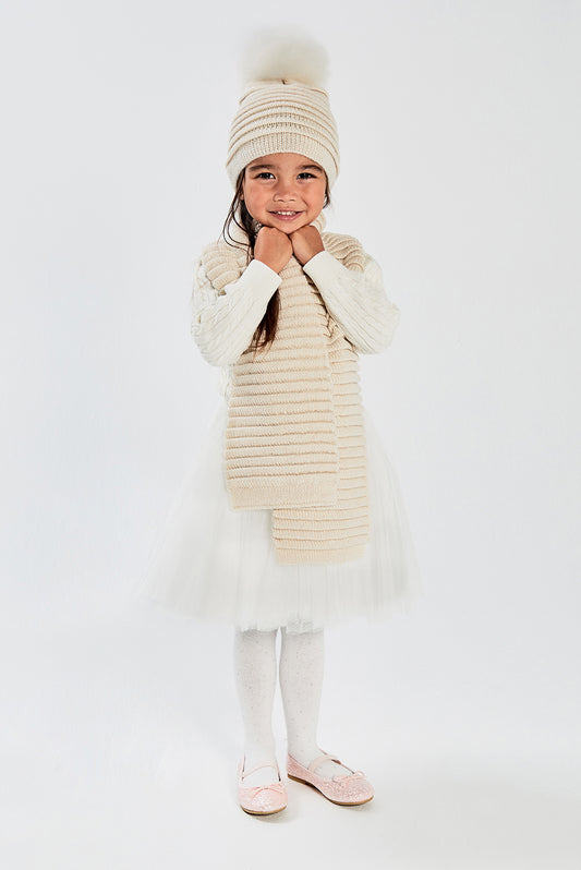 Sentaler Kids (1-5 Years) Ribbed Hat with Oversized Fur Pompon and Ribbed Scarf featured in Baby Alpaca and available in Ivory. Seen from front on model.